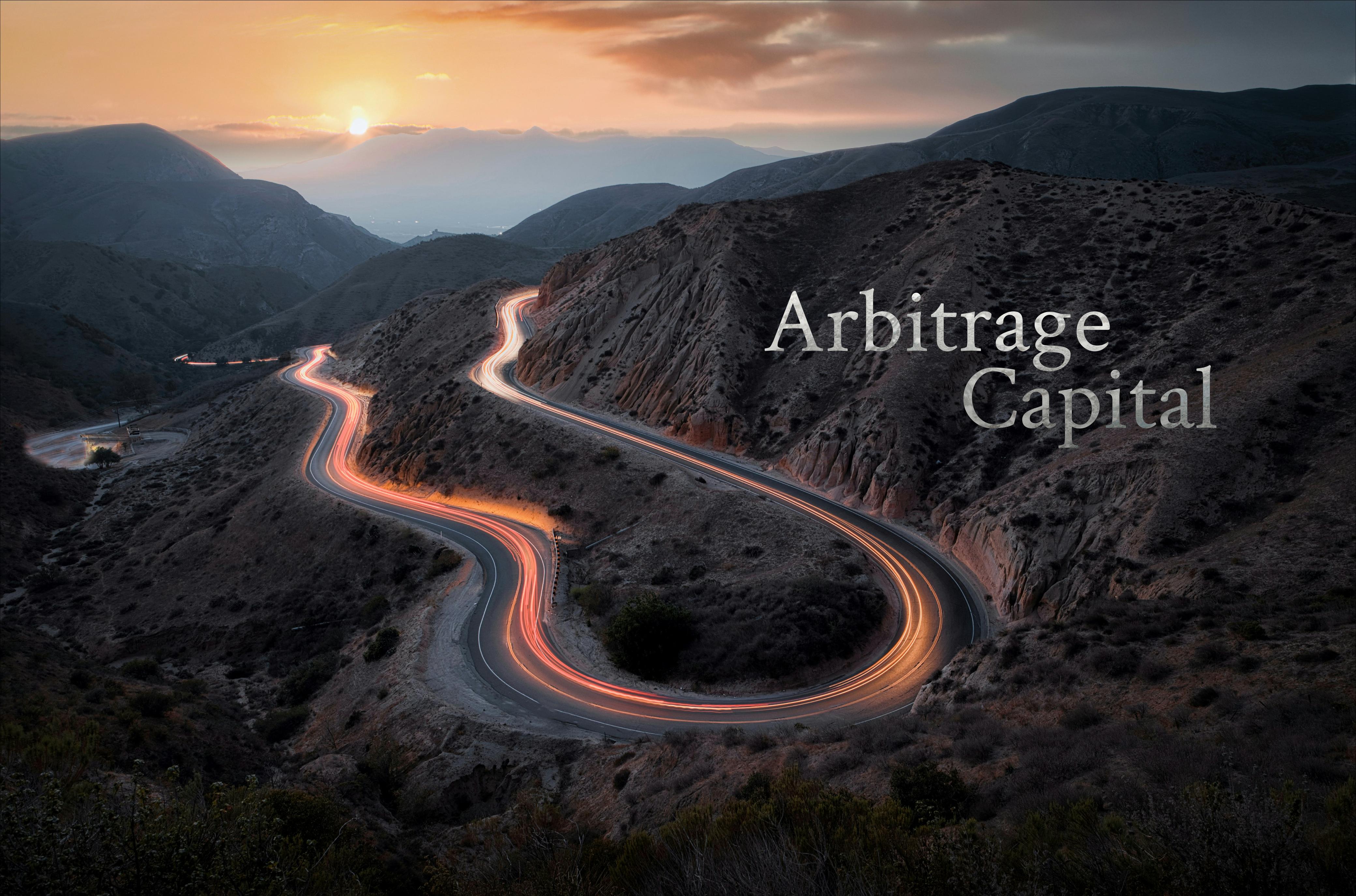 Winding road through mountains with Arbitrage Capital branding