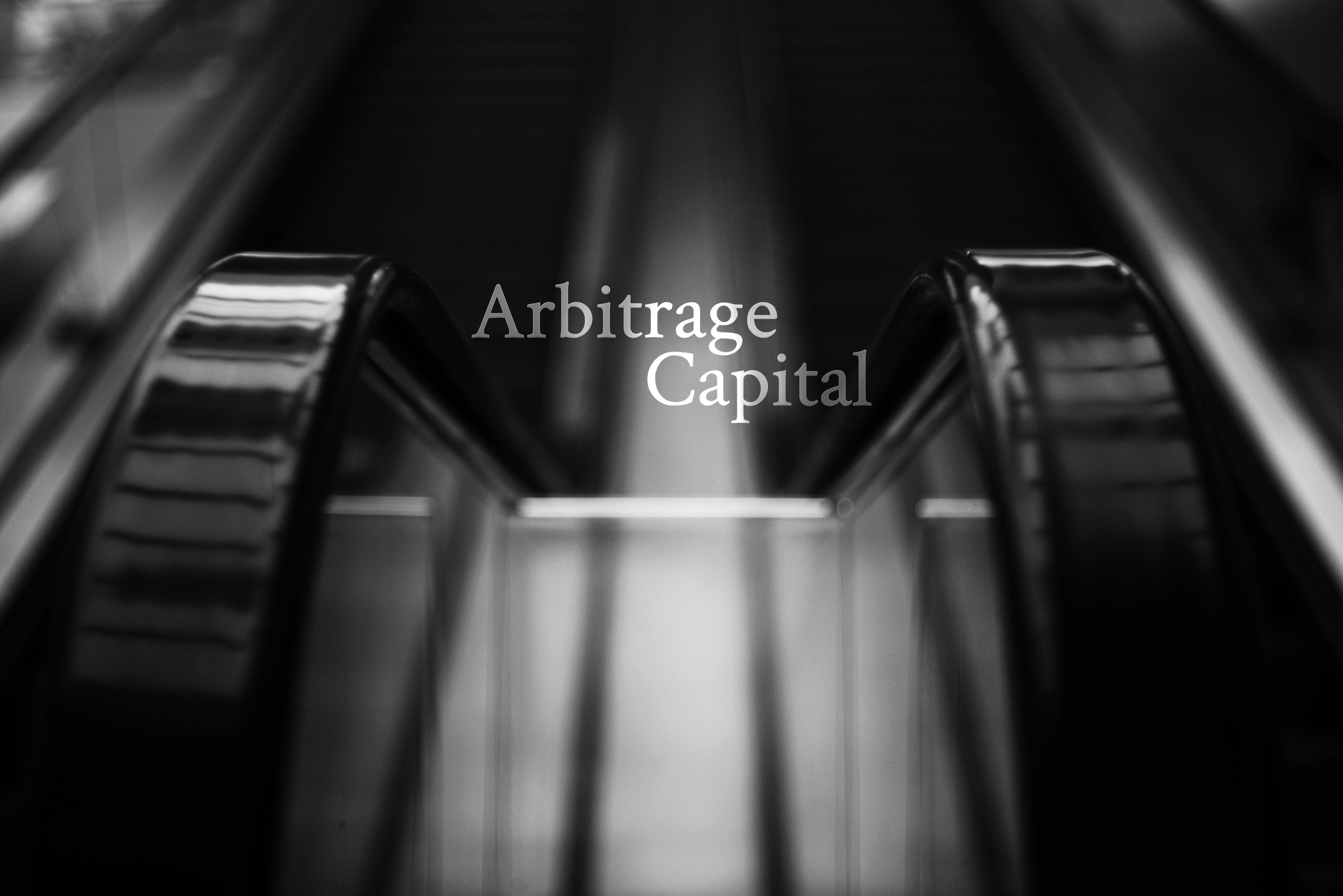 Modern escalator with Arbitrage Capital branding